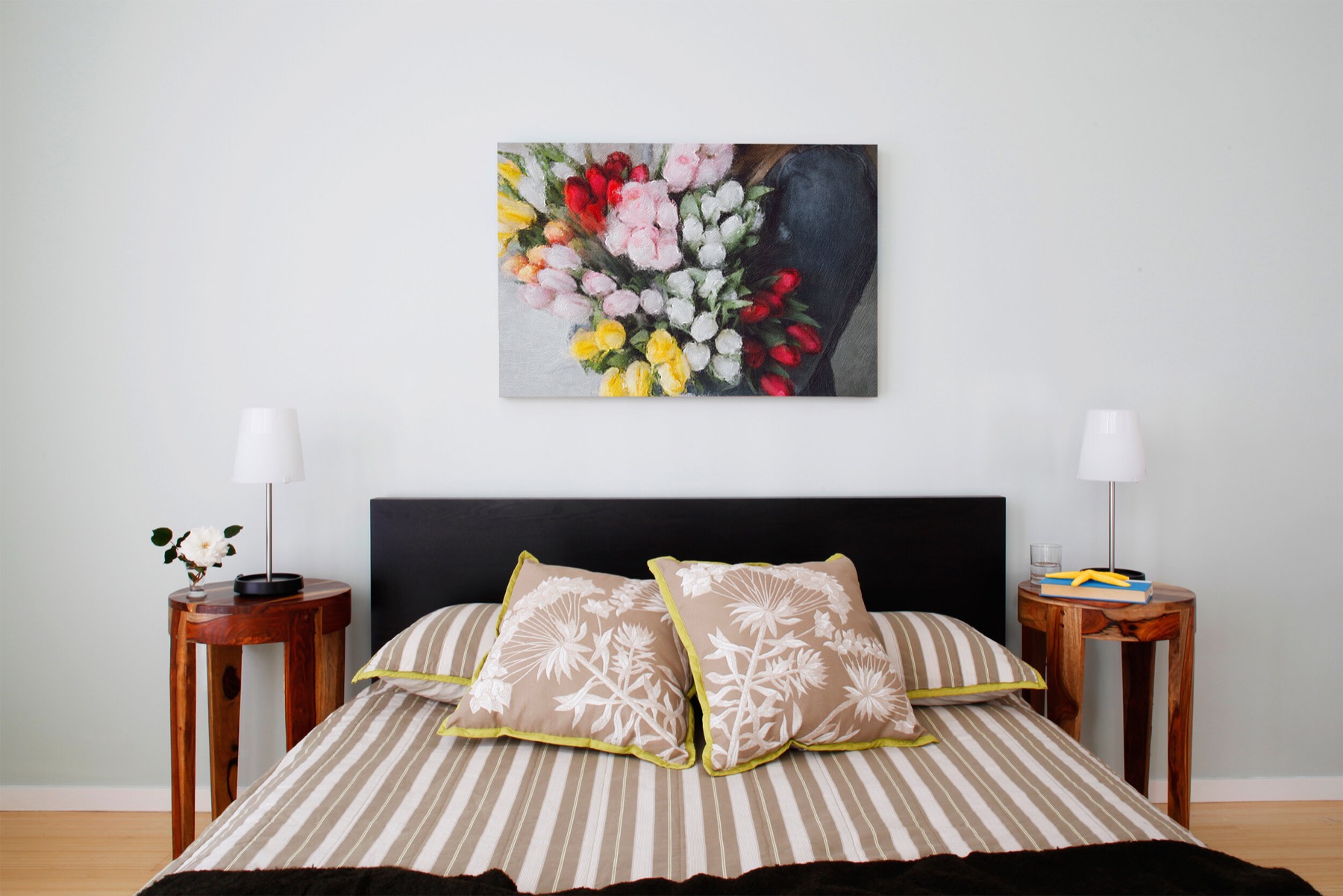 Framed canvas print of a Brushstroke painting hanging in a bedroom
